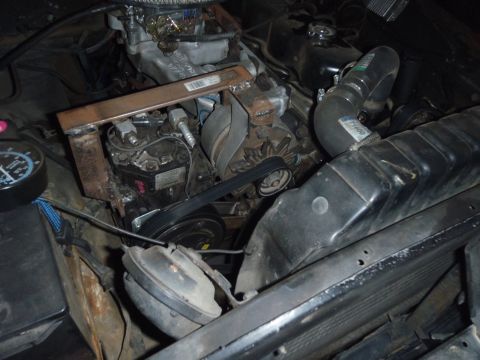 1978 Ford Bronco - Close-up view of an engine compartment, highlighting the air conditioning system and associated engine components.