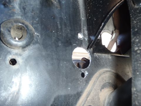 1978 Ford Bronco - This image shows a section of a vehicle's frame with multiple holes, suggesting modification or repair work.