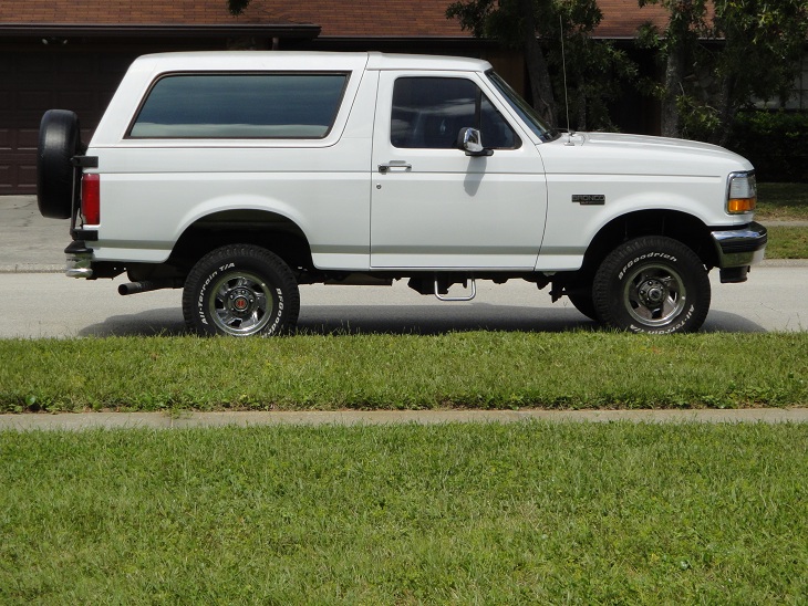 White 1994 Ford Bronco parked on a street