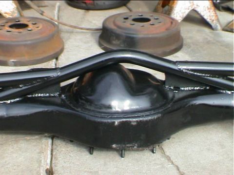 1979 Ford Bronco - Rear axle housing with brake drums visible in the background.