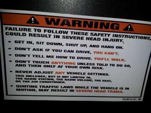 1986 Ford Bronco - A warning sticker with safety instructions and the SuperMotors logo is visible.