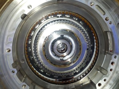 1995 Ford Bronco - Internal view of an automatic transmission, showing multiple layers of gears and clutch components.