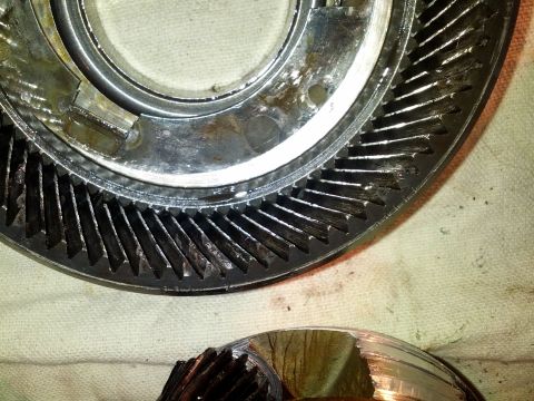 1995 Ford Bronco - Worn gears from a vehicle's transmission are shown, indicating potential mechanical issues.