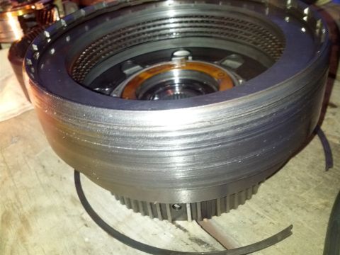 1995 Ford Bronco - Close-up of a transmission clutch pack showing signs of wear on the friction plates.