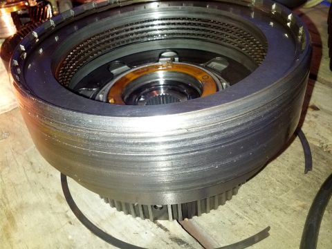 1995 Ford Bronco - Close-up of a transmission clutch pack showing wear on the friction plates.