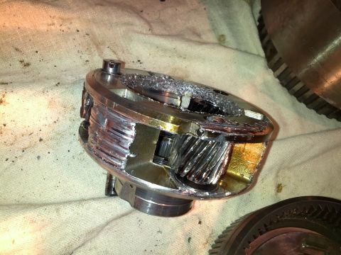 1995 Ford Bronco - Close-up of severely damaged differential gears, indicating a catastrophic failure within the transmission component.