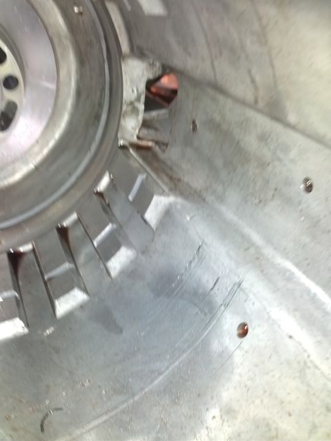 1995 Ford Bronco - Close-up view of the inside of a transmission housing, showing wear and potential damage to internal components.