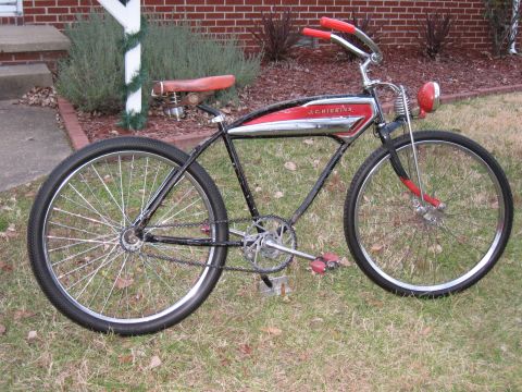 1994 Ford Bronco - A vintage J.C. Higgins bicycle with a red seat and handlebars sits on a grassy lawn.