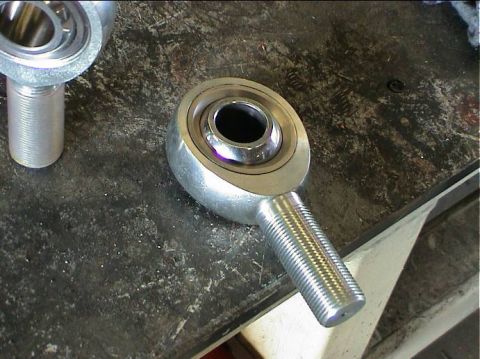1979 Ford Bronco - Close-up of a rod end bearing, a component used in automotive suspension and steering systems.