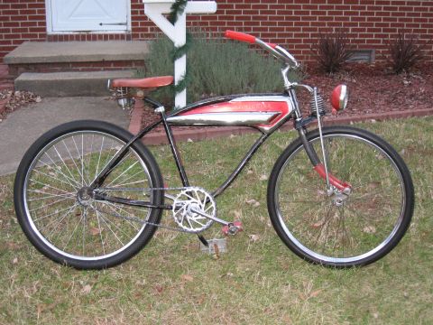 1994 Ford Bronco - This vintage-style cruiser bicycle features a distinctive red and chrome tank and red handlebars.