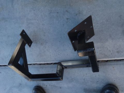 1978 Ford Bronco - Custom fabricated metal brackets are shown laid out on a concrete surface.