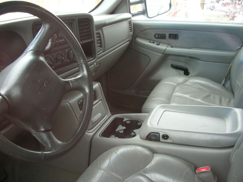 2001 GMC Sierra 3500 interior showing dashboard, steering wheel, center console, and passenger seat