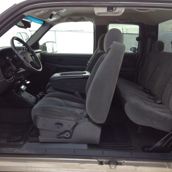 Chevrolet extended cab truck interior with gray cloth front buckets and rear jump seats