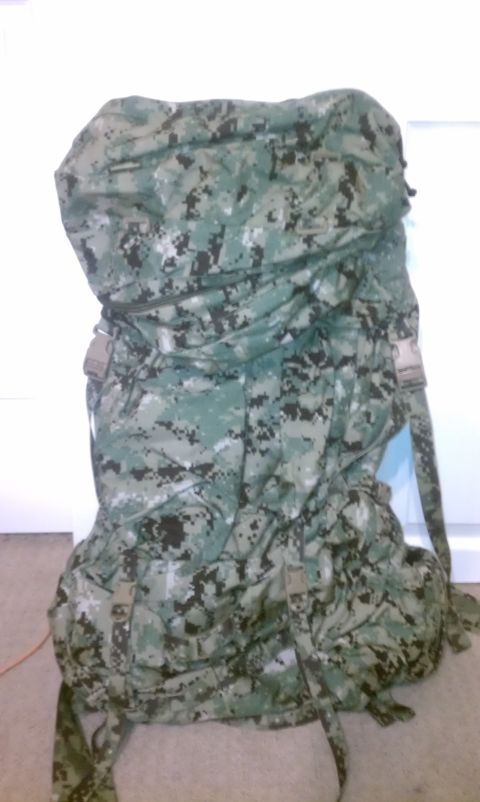1989 Ford Bronco - A large military backpack with a digital camouflage pattern is shown against a plain background.