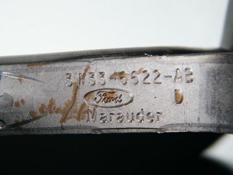 2004 Ford Crown Victoria - Close-up of a Ford part stamped with 'Marauder', indicating it's from that model.
