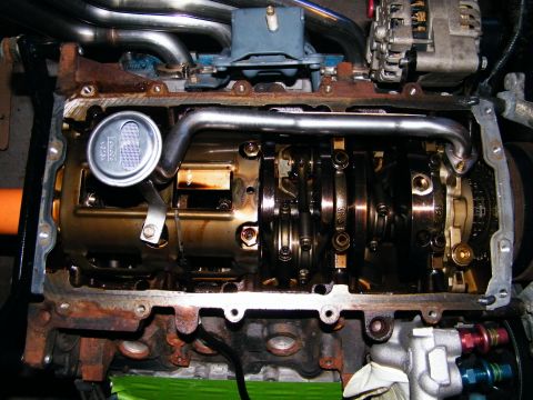 2004 Ford Crown Victoria - Close-up view of an engine's internal components, including the crankshaft and connecting rods.