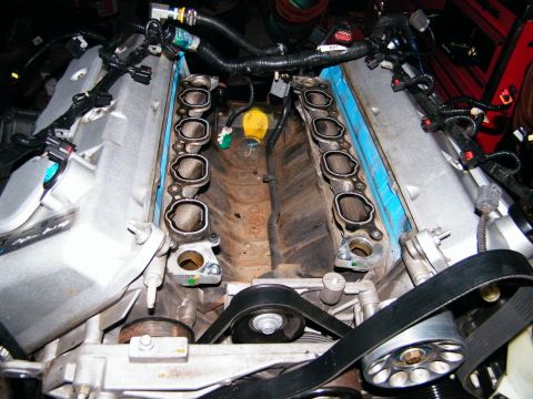 2004 Ford Crown Victoria - Close-up view of an engine's intake manifold during a repair or rebuild.