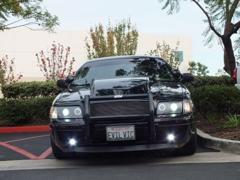2003 Ford Crown Victoria - Front shot of a low Crown Victoria, grille guard around billet insert, halo headlights and foglights on.