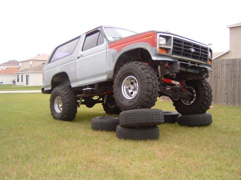 1983 Ford Bronco - This modified Ford Bronco features large off-road tires and a two-tone paint scheme.