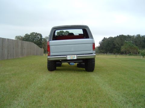 1983 Ford Bronco - This 1983 Ford Bronco is shown from the rear, its removable top and large tires.