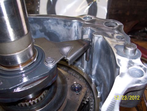1990 Ford Bronco - A close-up view of a metal part from a vehicle's transmission system.
