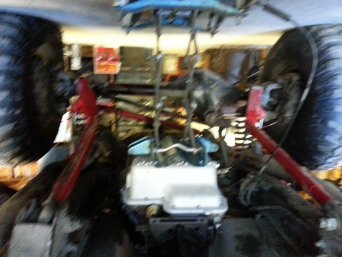 1978 Ford Bronco - Underside view of a vehicle's engine and suspension system, with visible Supermotors.net branding.