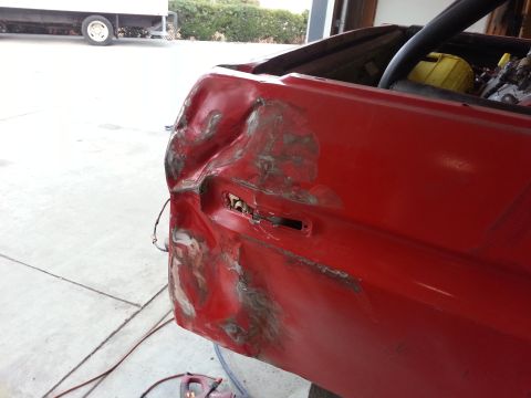 1978 Ford Bronco - This vehicle's rear quarter panel has significant damage and is being prepped for repair.