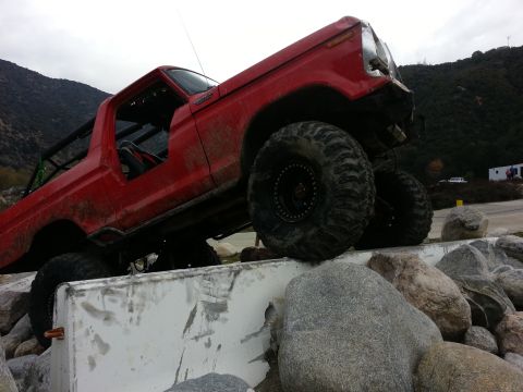 1978 Ford Bronco - 1978 Ford Bronco modified for off-road use, navigating a rocky obstacle course.