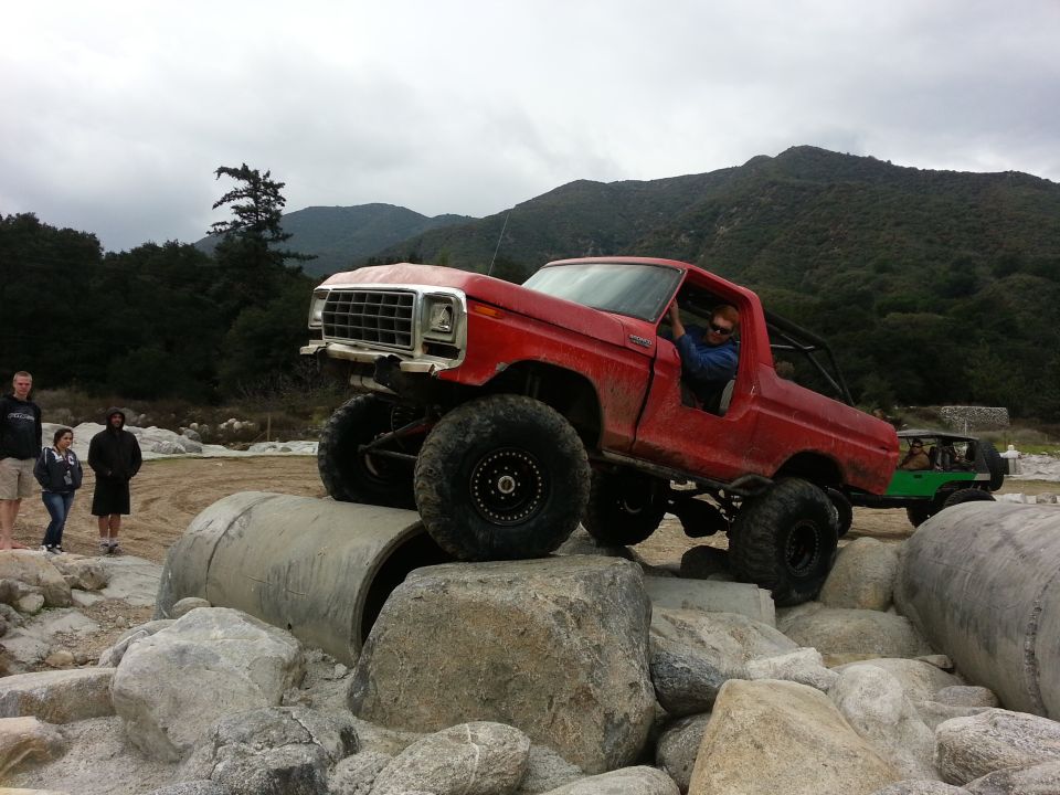 1978 Ford Bronco climbing rocks, red, 3q-front view