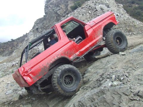 1978 Ford Bronco - This modified 1978 Ford Bronco navigates a steep, rocky incline, its off-road capabilities.