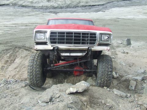 1978 Ford Bronco - This heavily modified 1978 Ford Bronco is shown navigating a challenging rocky landscape.