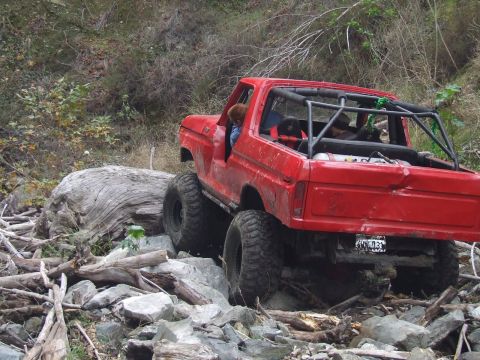 1978 Ford Bronco - This modified 1978 Ford Bronco is shown off-roading on a challenging, rocky path.