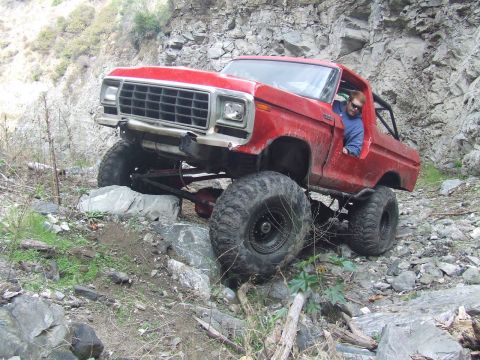 1978 Ford Bronco - This lifted 1978 Ford Bronco is shown off-roading on a rocky trail.