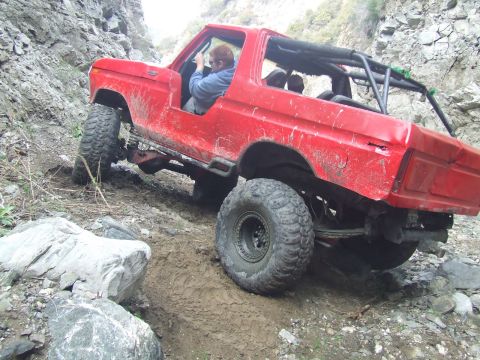 1978 Ford Bronco - This 1978 Ford Bronco is navigating a challenging off-road course in a canyon.
