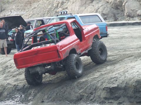 1978 Ford Bronco - This modified 1978 Ford Bronco is seen off-road with a prominent roll cage and large tires.