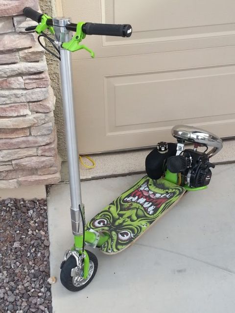 1978 Ford Bronco - Custom gas-powered scooter built on a skateboard deck with a monster graphic and chrome exhaust pipe.