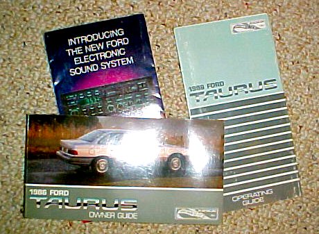 2003 Ford Expedition - The image displays the owner's guide and operating guide for a 1986 Ford Taurus, along with a booklet about Ford's electronic sound system.