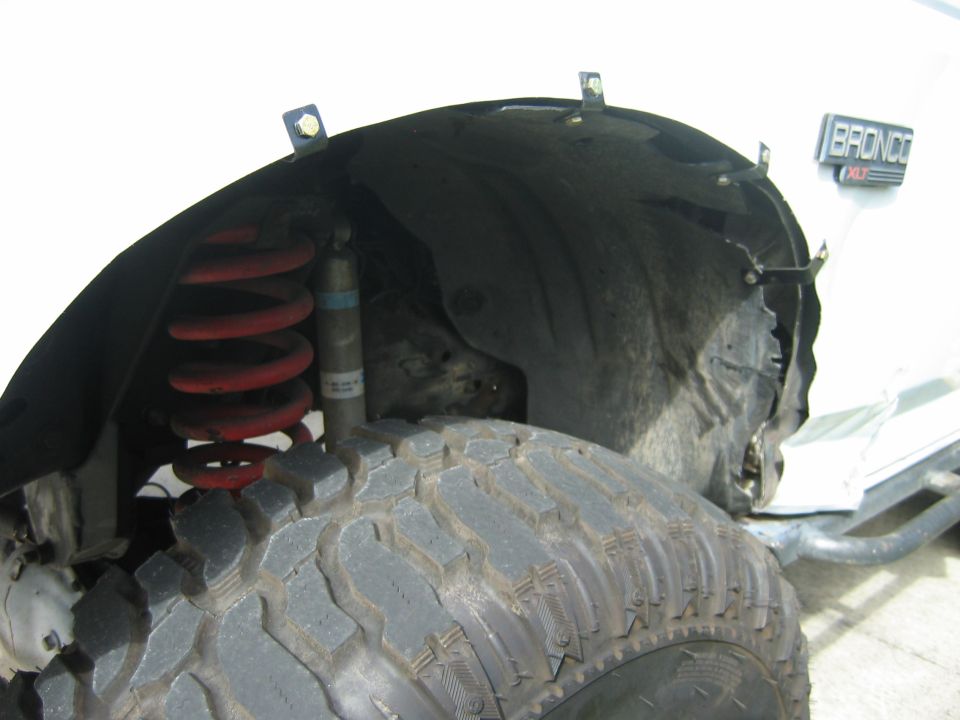 close up of the crunched drivers side fender.