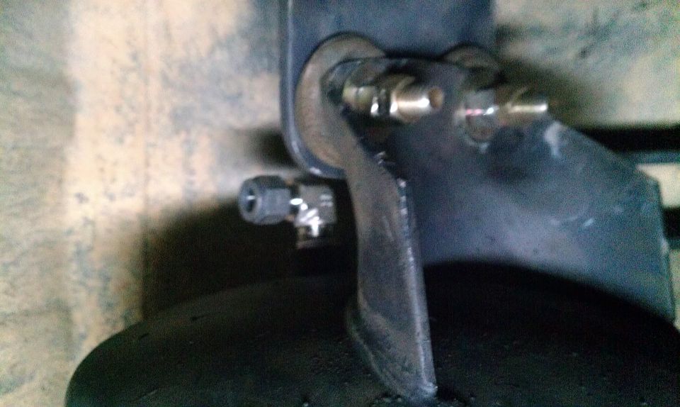 Rear shock hoop mounting bracket with bolts and brake line fitting
