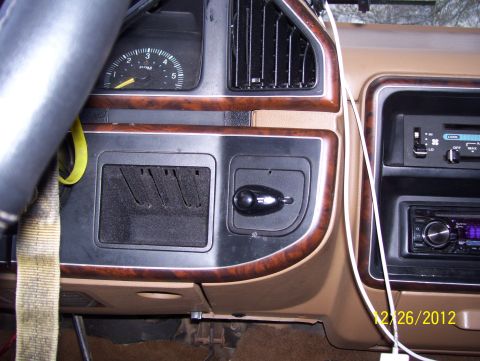 1990 Ford Bronco - Close-up of a vehicle's dashboard, showing the instrument cluster and center console details.