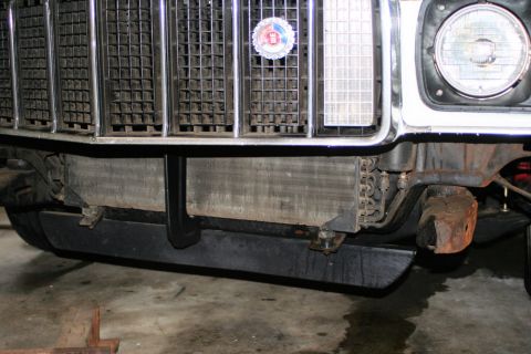 1976 Ford Ranchero - Close-up of a vehicle's front end, focusing on the grille and exposed radiator assembly.