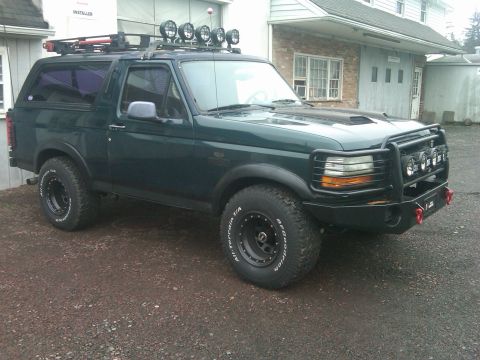 1993 Ford Bronco - This 1993 Ford Bronco features a custom off-road bumper and roof rack, suggesting it is equipped for adventure.