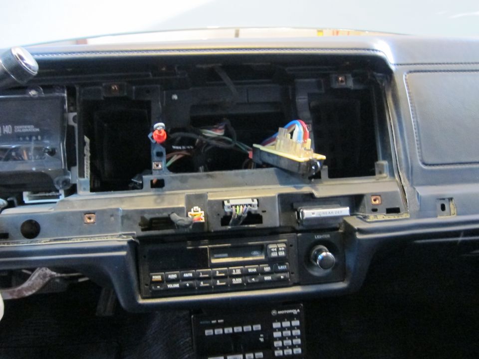 1991 Ford Crown Victoria LTD dashboard with radio and trim removed, showing wiring
