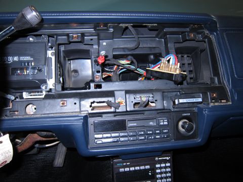 1991 Ford LTD Crown Victoria - The dashboard of a 1991 Ford Crown Victoria LTD shows the radio and exposed wiring.