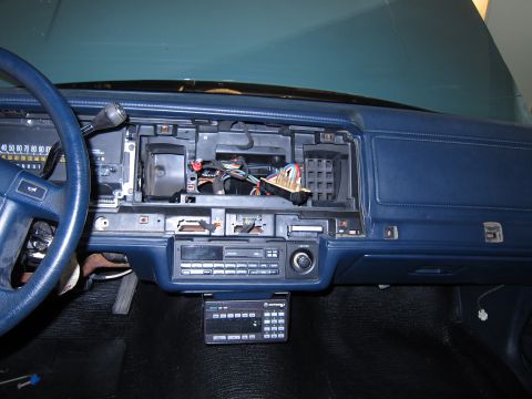 1991 Ford LTD Crown Victoria - Interior view of a 1991 Ford Crown Victoria LTD dashboard, showing the radio and exposed wiring.