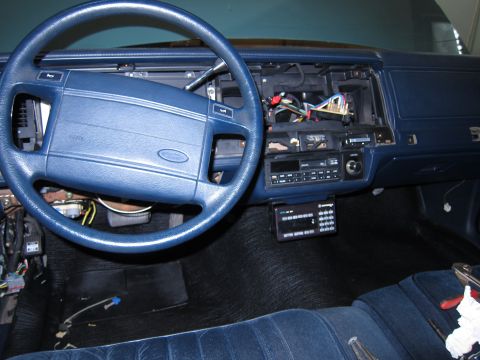 1991 Ford LTD Crown Victoria - The interior of a 1991 Ford Crown Victoria LTD shows a disassembled dashboard with wiring exposed.