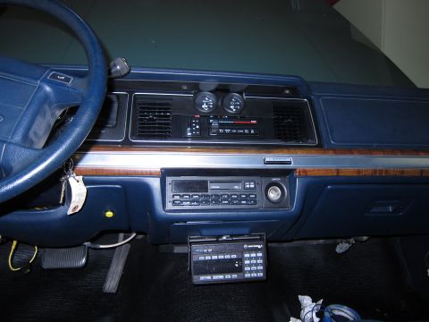 1991 Ford LTD Crown Victoria - Interior view of a 1991 Ford Crown Victoria LTD, showing the blue dashboard, steering wheel, and dual-DIN radio setup.