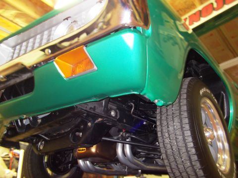 1971 Ford Ranchero - Underside view of a green pickup truck, highlighting its exhaust system and suspension components.