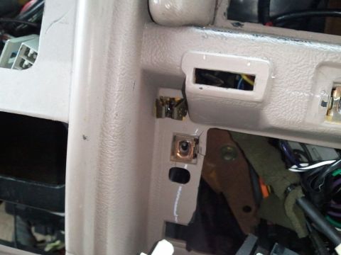 1994 Ford Bronco - Interior view of a 1994 Ford Bronco dashboard, showing exposed wiring and mounting points.