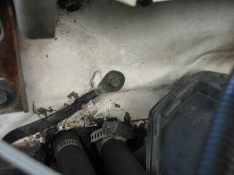 1992 Ford Bronco - ground strap passenger side firewall attaches to bolt on upper intake plenum.
